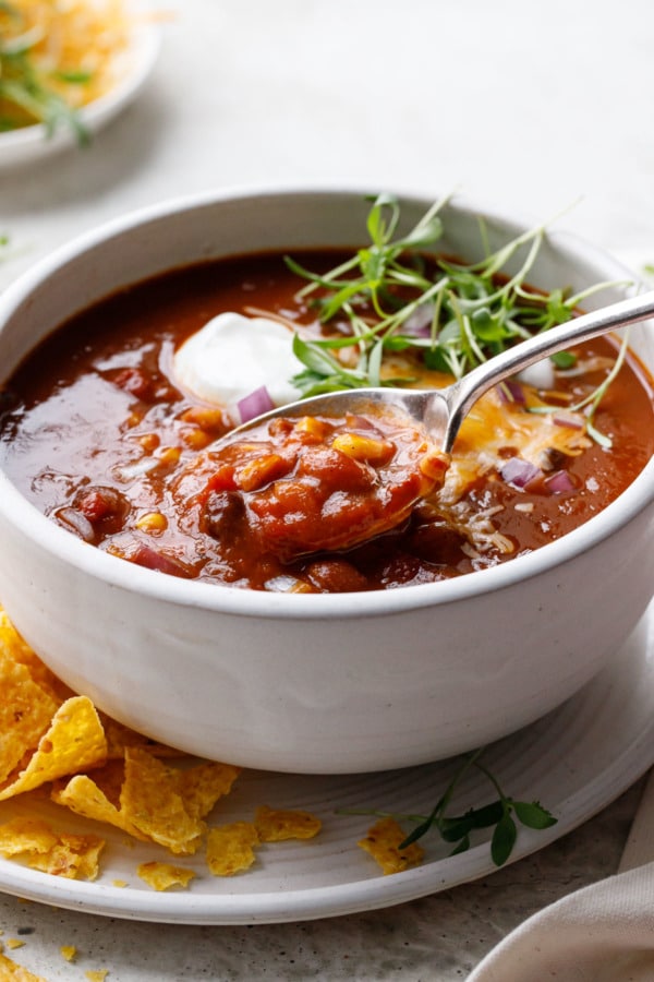 Spoonful of Vegetarian Pumpkin & Three-Bean Chili showing chunky texture