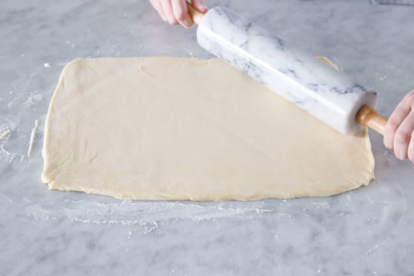 Rolling out the sticky bun dough