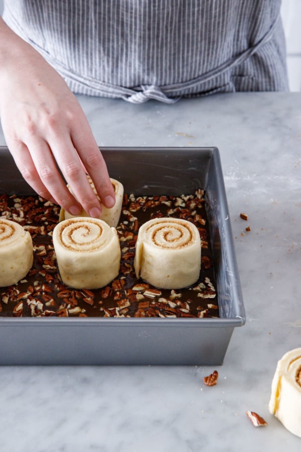 Arrange rolls on top of caramel and pecans in pan