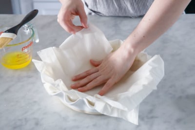Make the phyllo crust by layering sheets of phyllo in deep dish pie pan