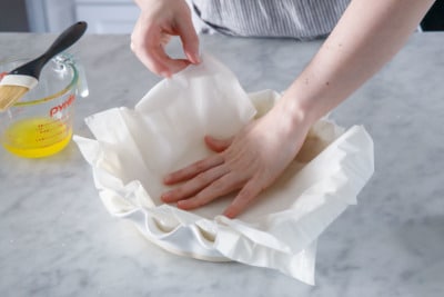 Make the phyllo crust by layering sheets of phyllo in deep dish pie pan