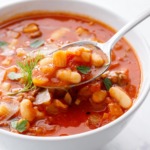 Closeup, spoonful of Pasta e Fagioli soup