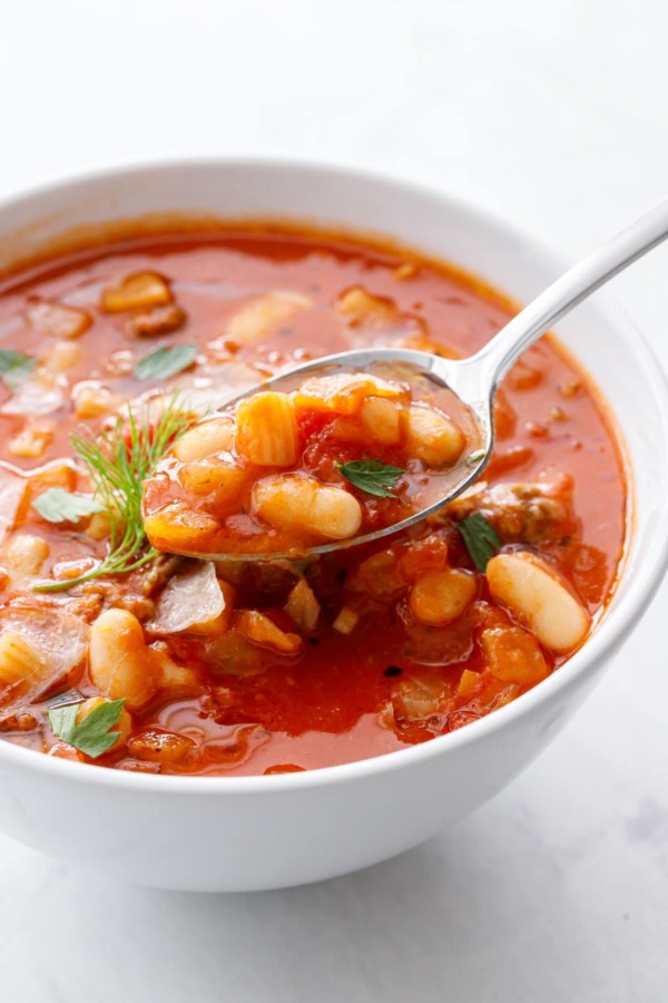 Closeup, spoonful of Pasta e Fagioli soup