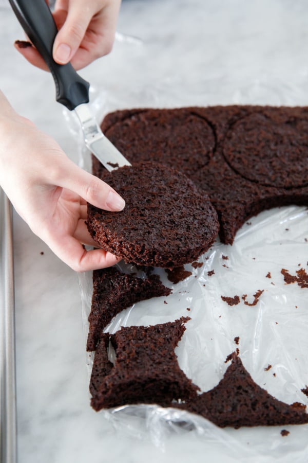 Cutting out 4-inch rounds of cake to assemble the naked layer cake