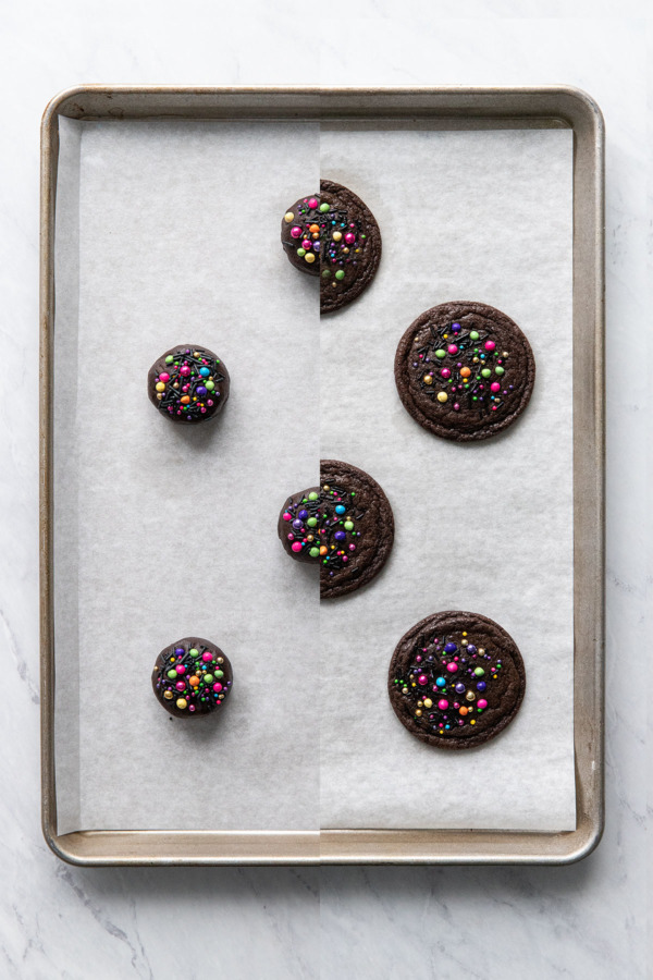 Split screen Cosmic Brownie Cookies Before and After baking.