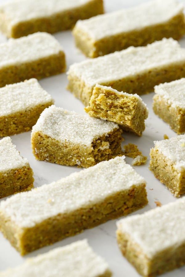 Geometric arrangement of rectangular cut cookies, one cookie broken in half to show texture