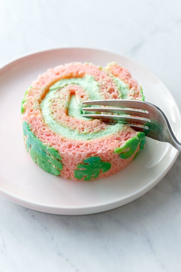 Slice of Cake Roll, pink cake with green stenciled leaves, plus a green pandan whipped cream filling