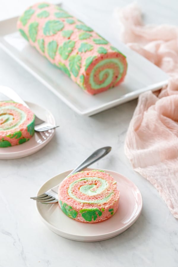 Plates with slices of Pink and green monstera leaf Cake Roll