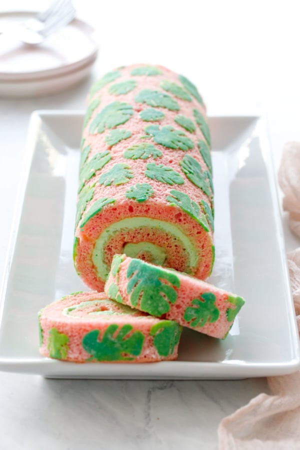 Monstera Stenciled Cake Roll, sliced to show the green pandan whipped cream spiral inside