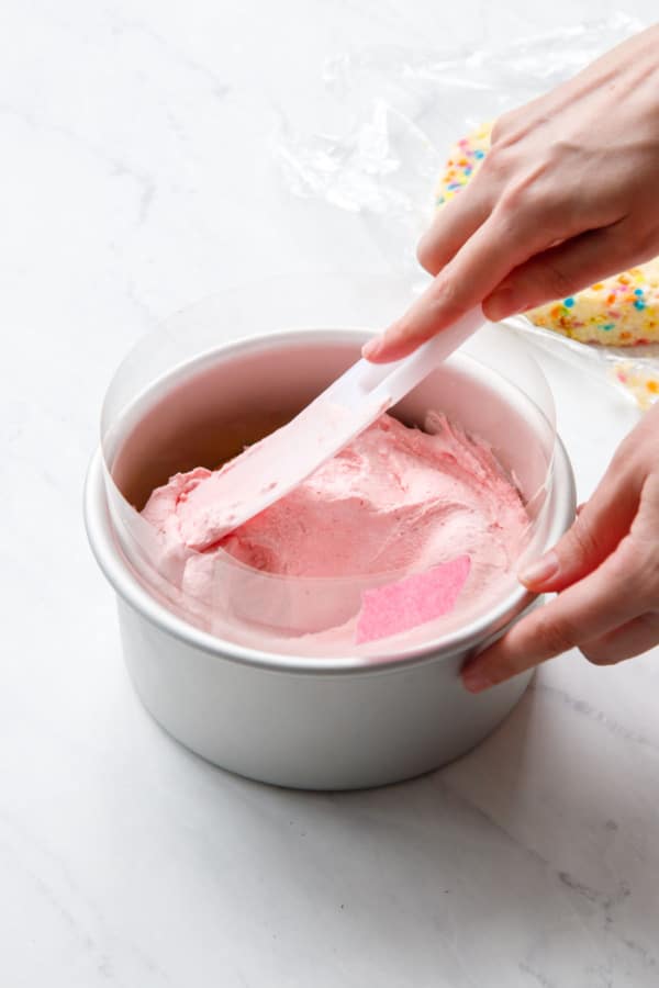 Assembling the Ice Cream Cake, spreading the ice cream evenly in pan