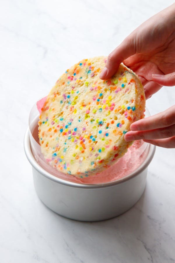 Assembling the Ice Cream Cake, placing the second layer on top of the ice cream