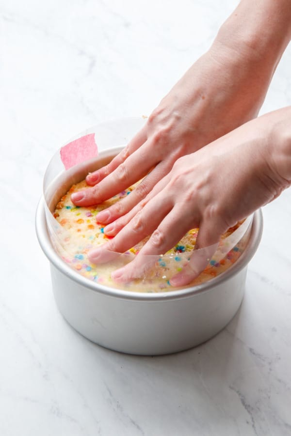 Assembling the Ice Cream Cake, pressing the second layer on top