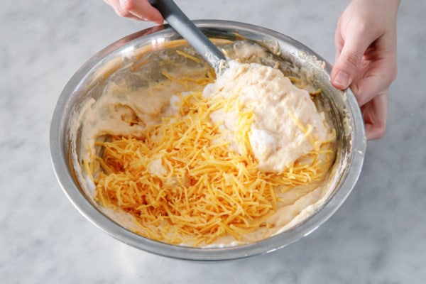 Folding the cheese into the waffle batter