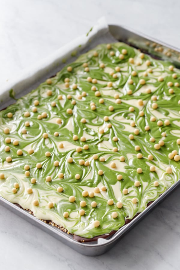 Pan with Matcha White Chocolate Crunch Bark, freshly swirled so the surface is still shiny