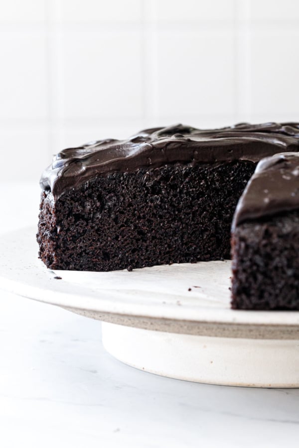 Cross section of a Sour Cream Chocolate Cake showing the ultra moist texture and extra dark chocolate color.