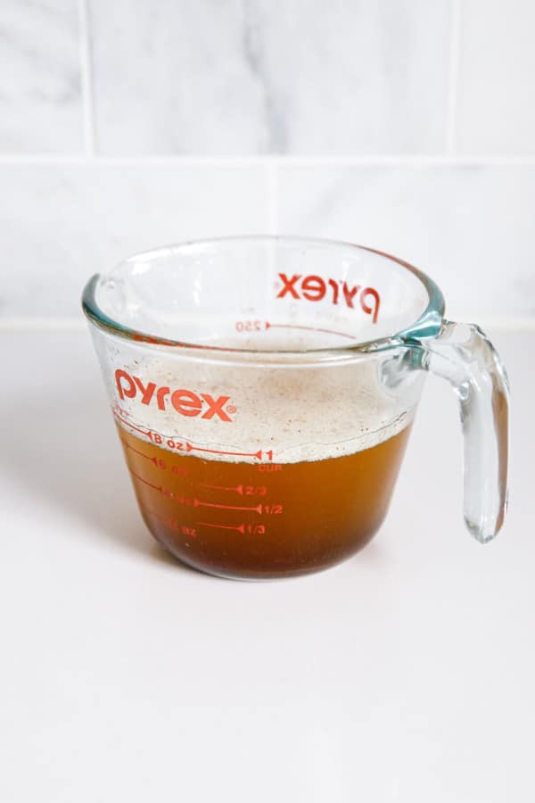 Pyrex measuring cup with brown butter after browning.