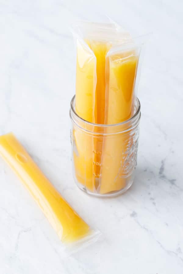 Jar with Mai Tai ice pops before freezing, freeze them vertically to avoid air bubbles.