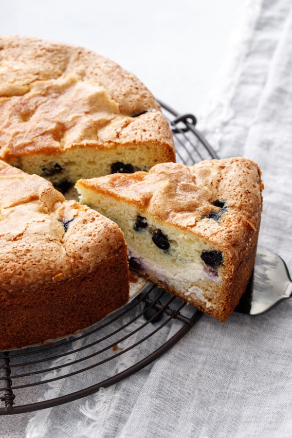 Slice of Blueberry Cream Cheese Coffee Cake showing a cross-section of the layers.