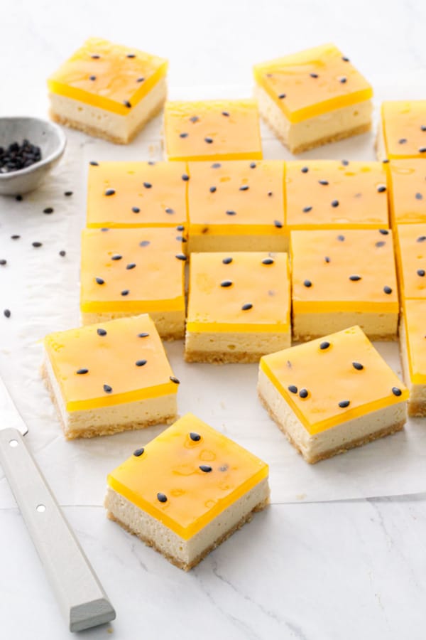 https://www.loveandoliveoil.com/wp-content/uploads/2022/11/passionfruit-cheesecake-bars-3-600x900.jpg