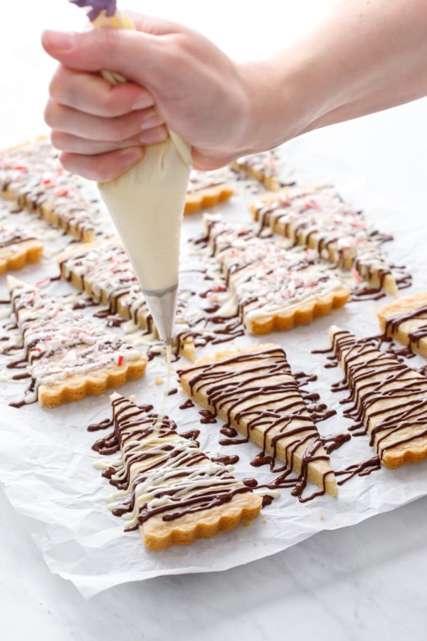 Drizzling the shortbread wedges with white chocolate on top of an already drizzled dark chocolate.