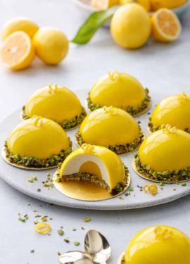 Pistachio & Meyer Lemon Mousse Cakes with Mirror Glaze
