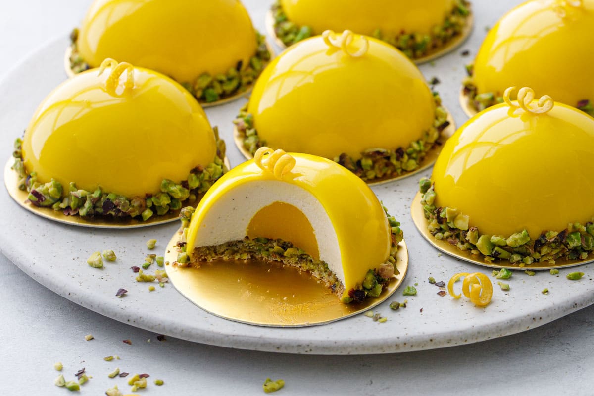 Pistachio & Meyer Lemon Mousse Cakes with Mirror Glaze