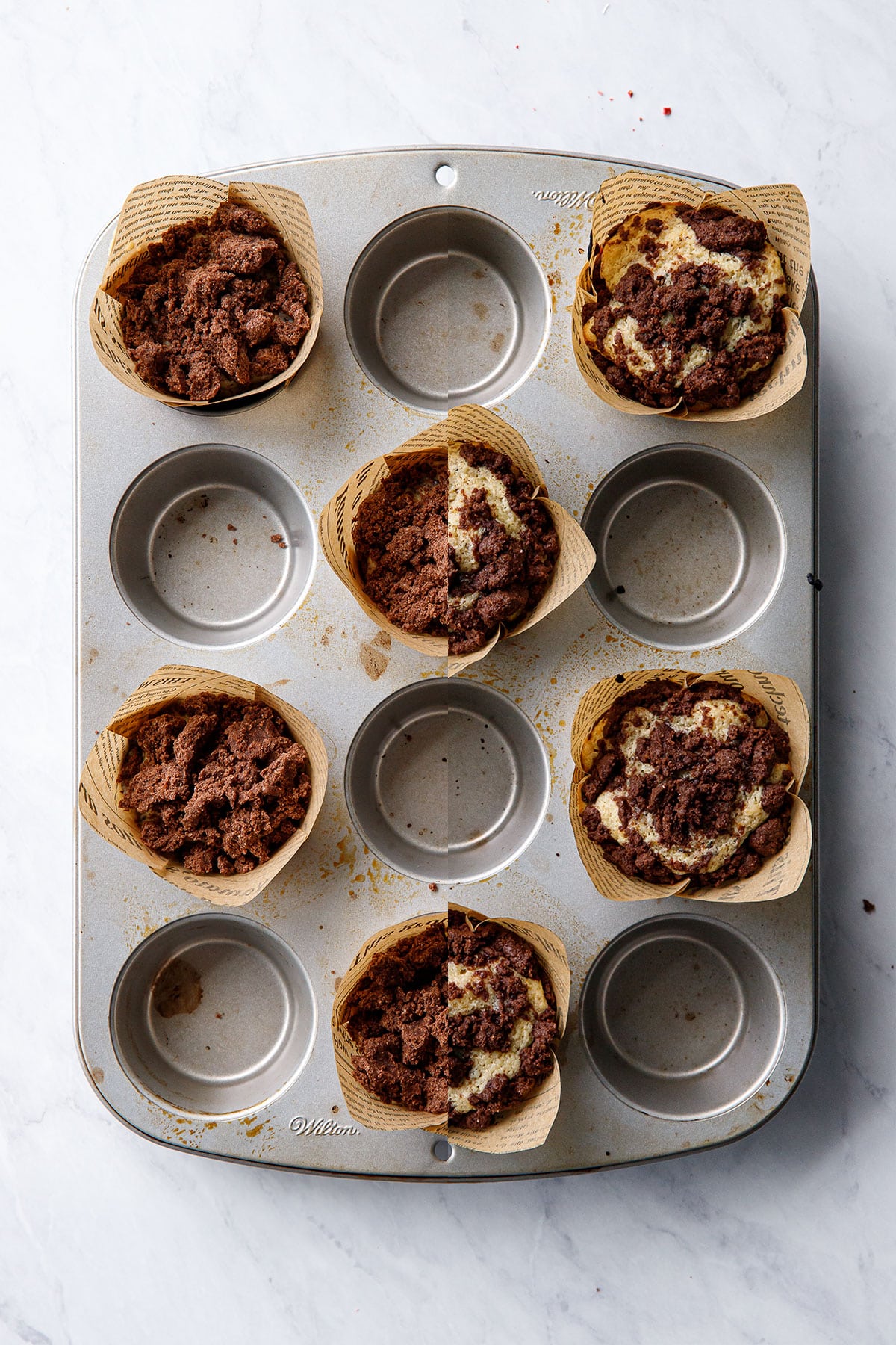 Overhead, split screen showing the chocolate streusel-topped muffins before and after baking.