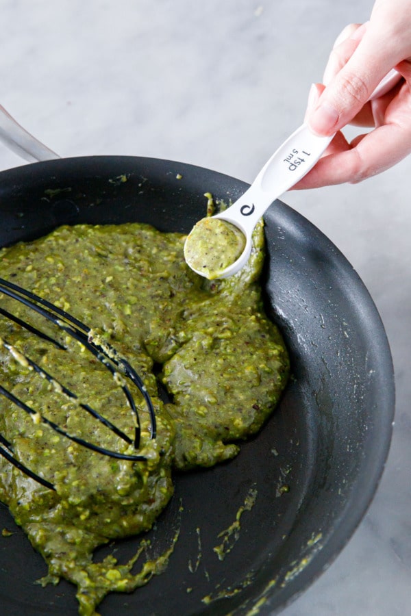 A level teaspoon full of pistachio Florentine cookie batter.