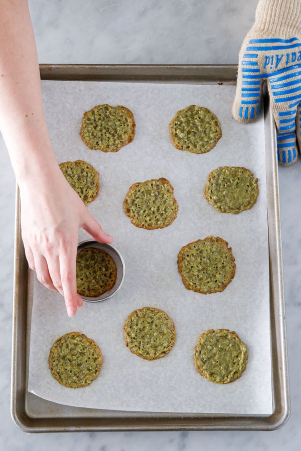 After baking, swirl a round cookie cutter around the warm cookies to make them more evenly round in shape.