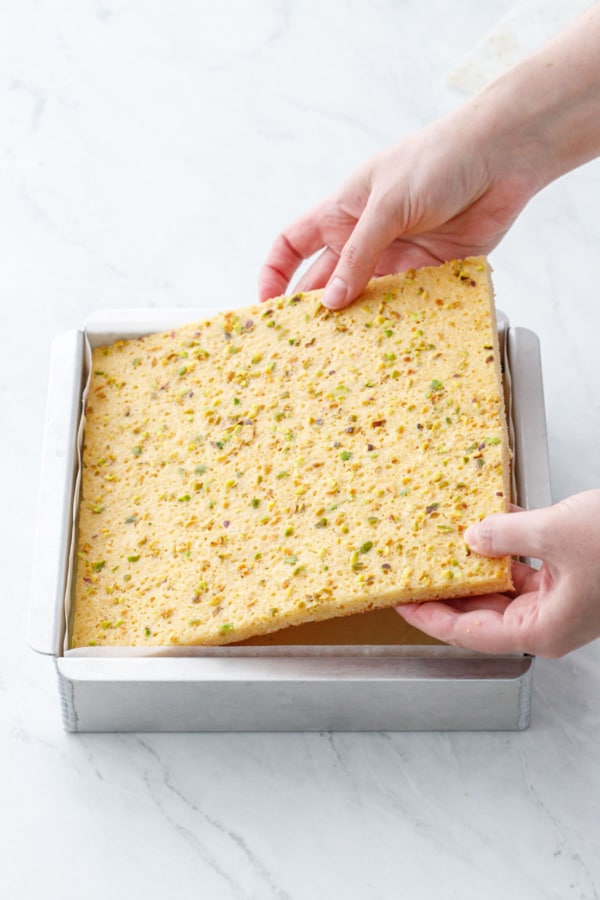 Adding the final layer of blondie on top of the ice cream.