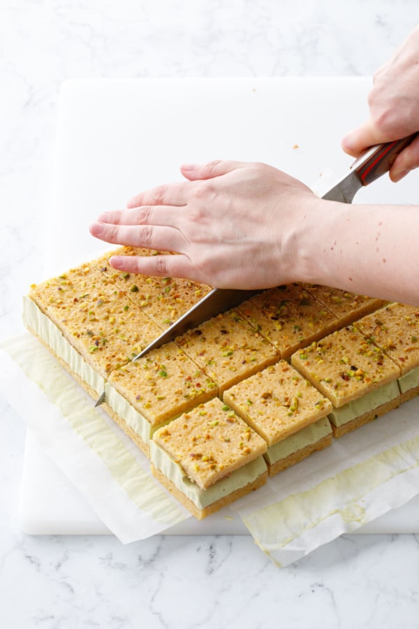 Use a large knife to cut ice cream sandwiches into 16 even squares.