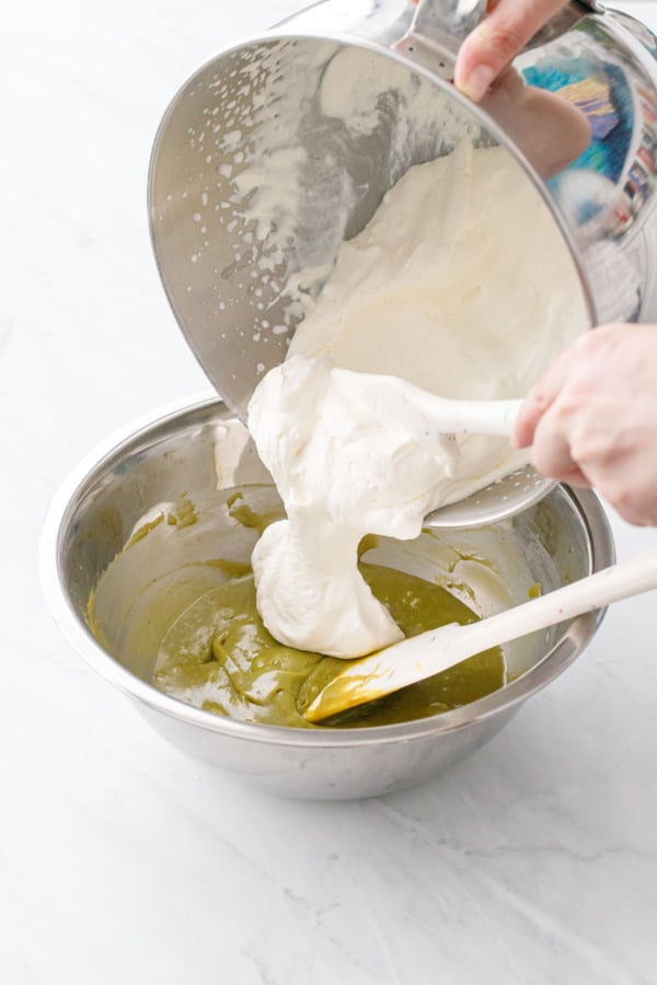 Making no-churn pistachio ice cream, adding about 1/3 of the whipped cream to the pistachio paste and sweetened condensed milk mixture.