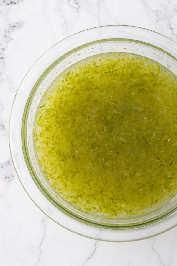 Overhead, bowl of Homemade Lime Cordial before resting for 24 hours.