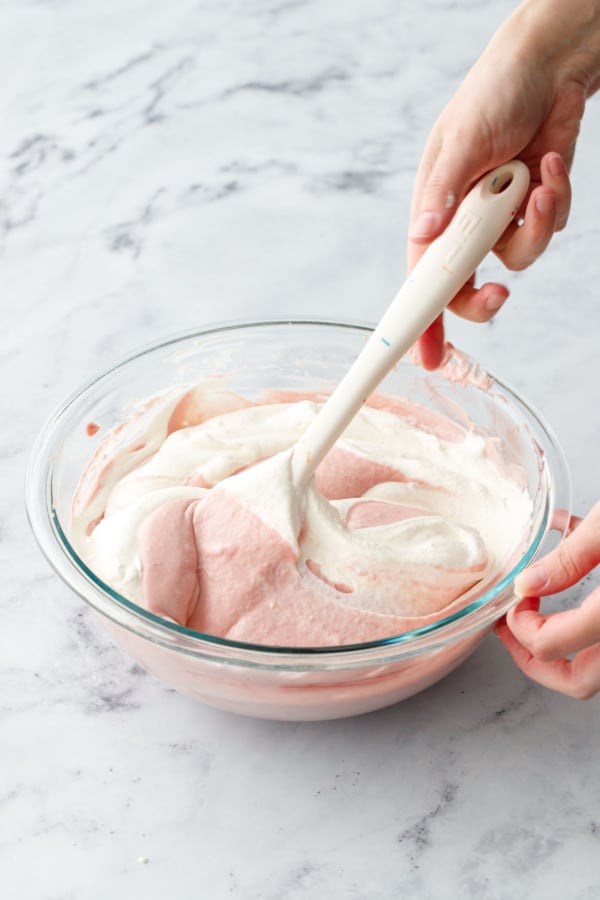 Use a large rubber spatula to fold in the rest of the whipped cream until mixture is smooth and no white streaks remain.