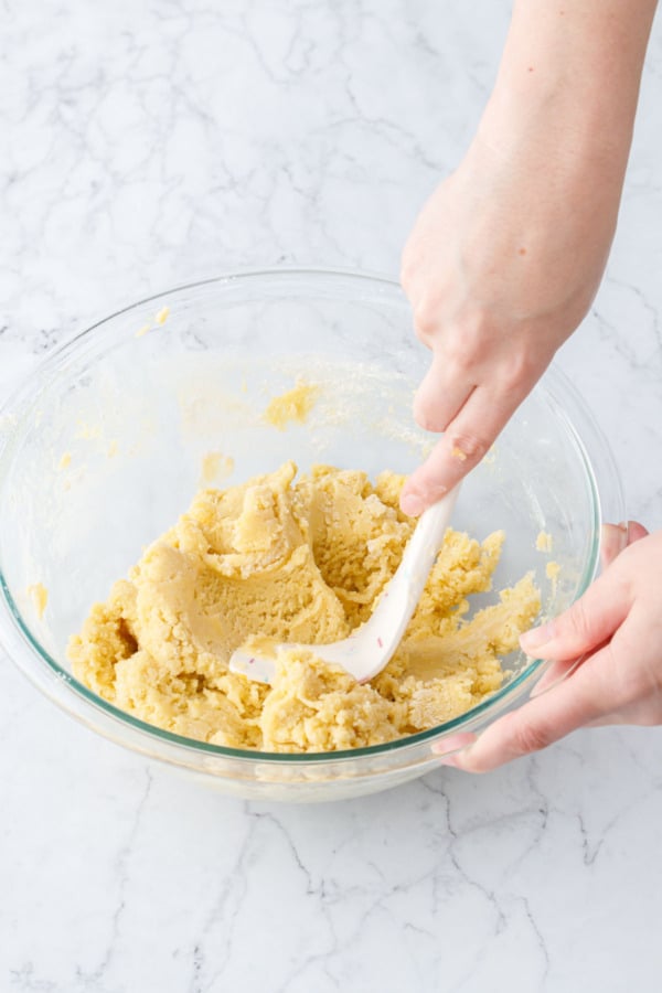 Mixing bowl with finished dough, showing the texture after mixing in the flour.