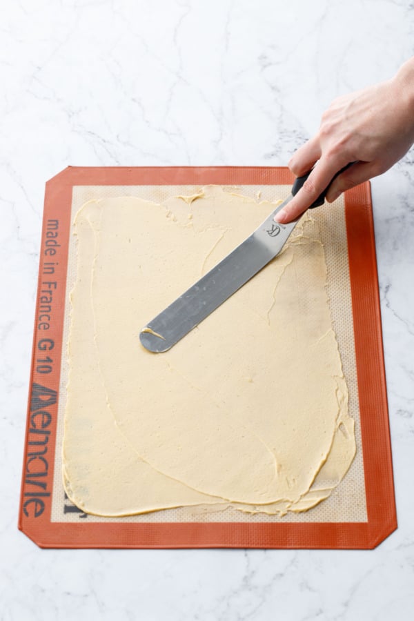 Offset spatula when finished spreading batter into a thin even layer on a silicone baking mat.