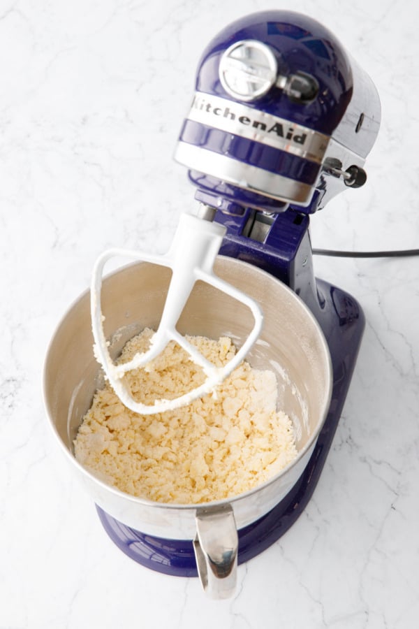 After mixing in butter to dry ingredients, the mixture will look like crumbly sand with pea-size and smaller pieces of butter.