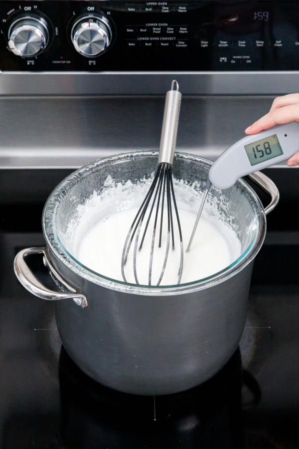 Using a digital thermometer to check for doneness (it will read 165-170 degrees when done).