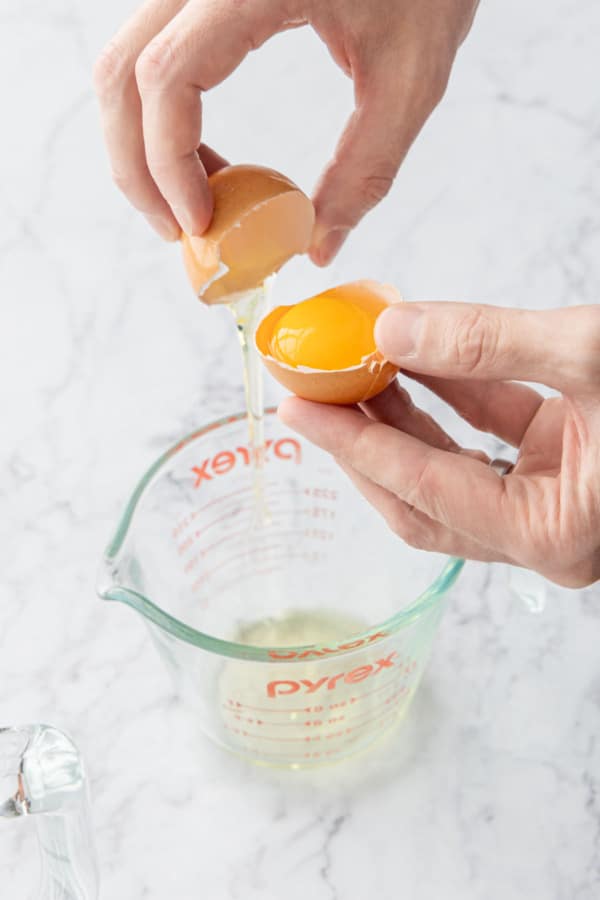 Separating eggs to use just the yolks.