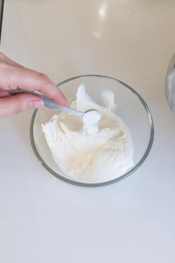 Adding baking soda to sour cream.
