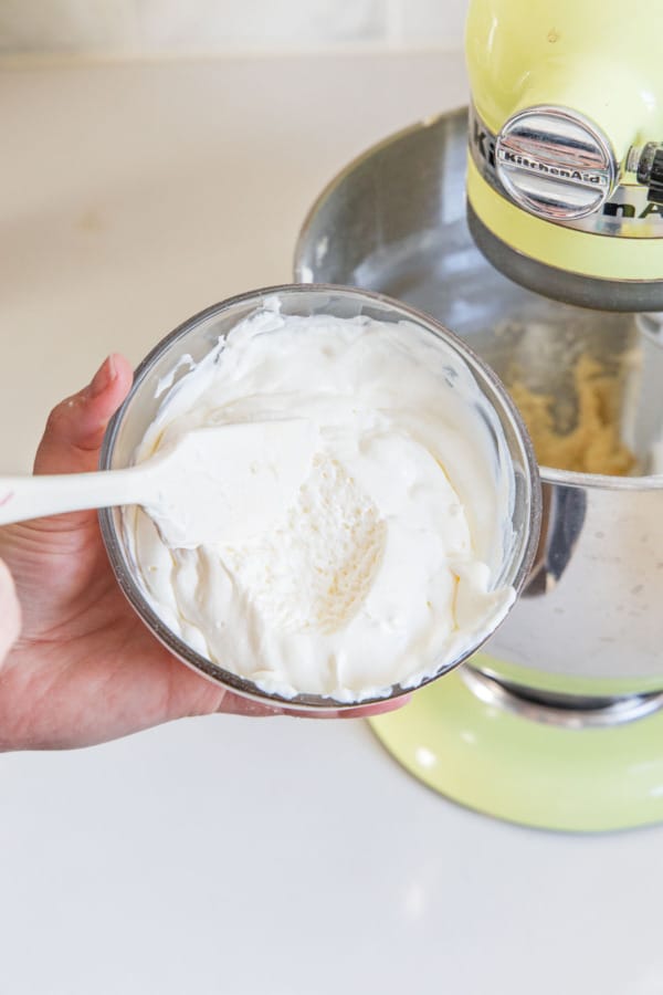 The foamy texture of the sour cream after adding baking soda.