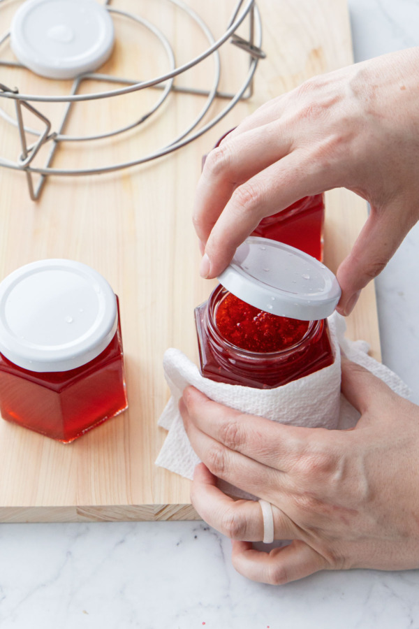 Securing lids onto jelly jars.