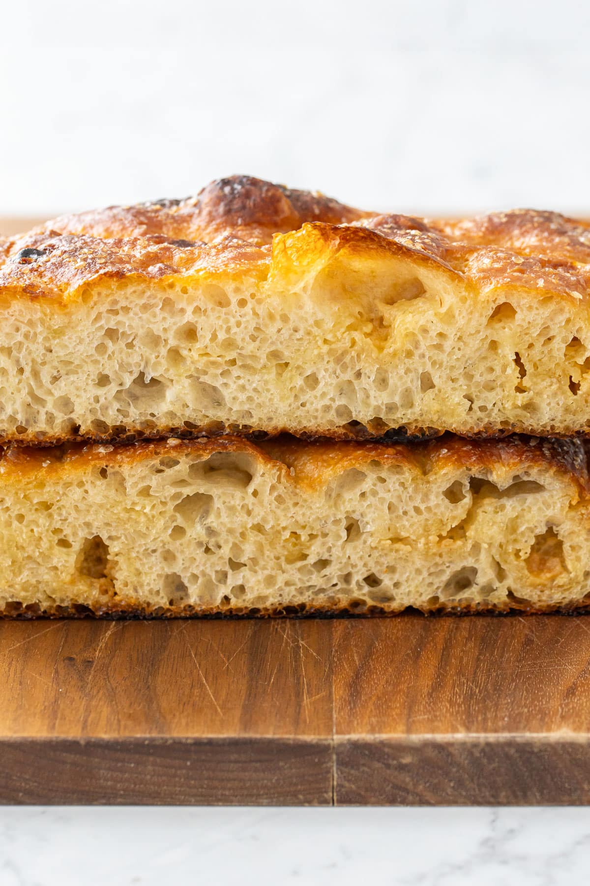 White Chocolate Focaccia Bread stacked to show the tender, bubbly interior crumb texture.