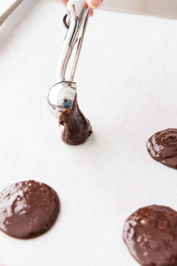 Drop small scoops of cookie batter onto a parchment lined baking sheet.