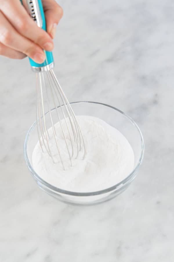 Whisking remaining sugar with pectin and baking soda in a small bowl.