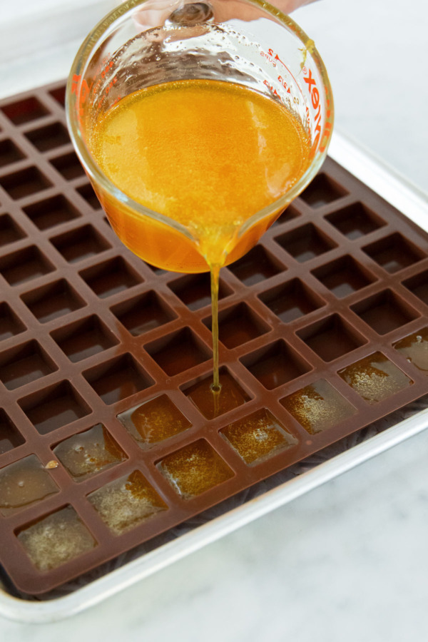 After adding citric acid, quickly pour into molds, either individual molds or a single silicone or parchment-lined cake pan.