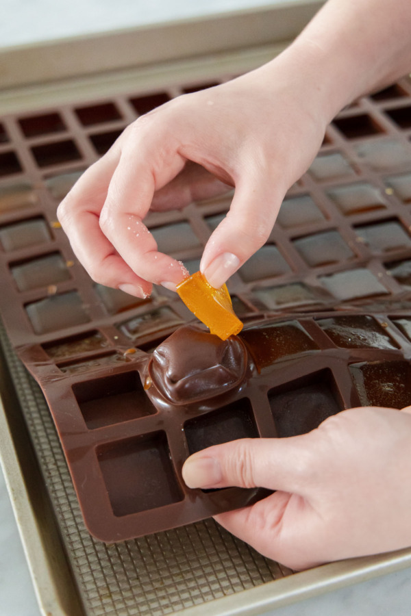 After sitting overnight, popping the set jellies out of the silicone mold.