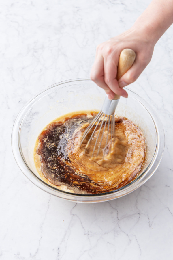 Mixing all wet ingredients along with brown butter in a mixing bowl.