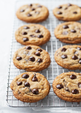 Rows of Brown Butter Banana Bread Chocolate Chip Cookies on a silver baking rack.